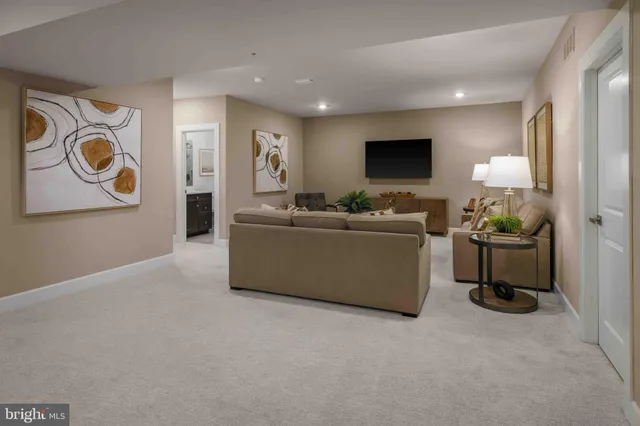 a large kitchen with a table and chairs