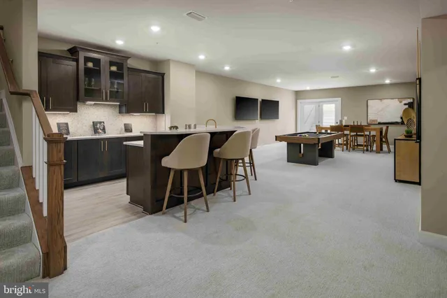 a kitchen with a sink a stove and cabinets
