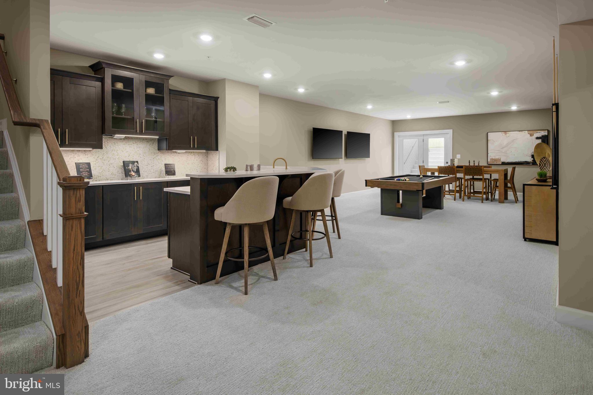 6497 Swimmer Row Way Columbia, MD 21044 - Photo 34 of 41 a large kitchen with a table and chairs