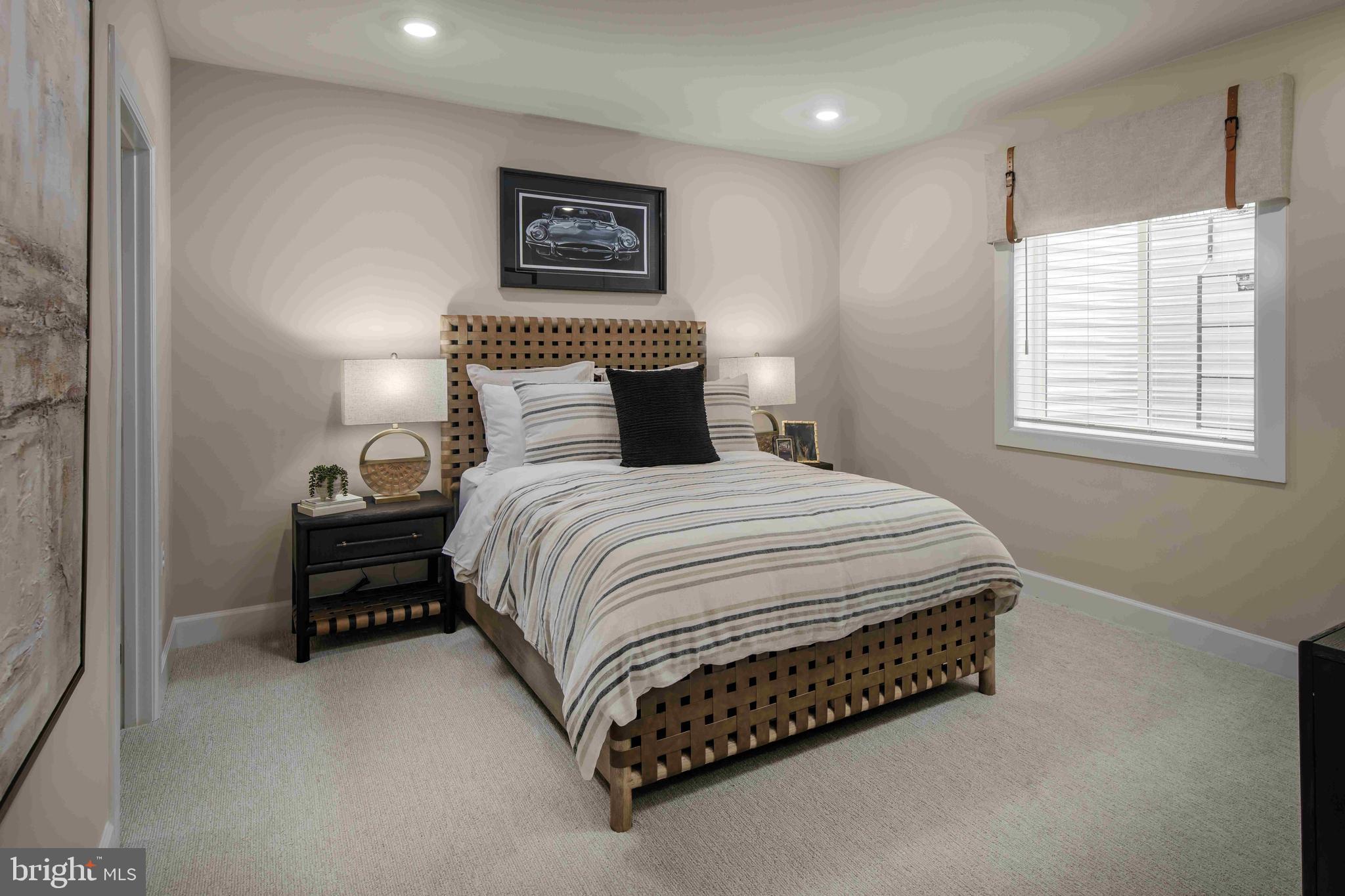 6497 Swimmer Row Way Columbia, MD 21044 - Photo 36 of 41 a bedroom with a bed and a night stand