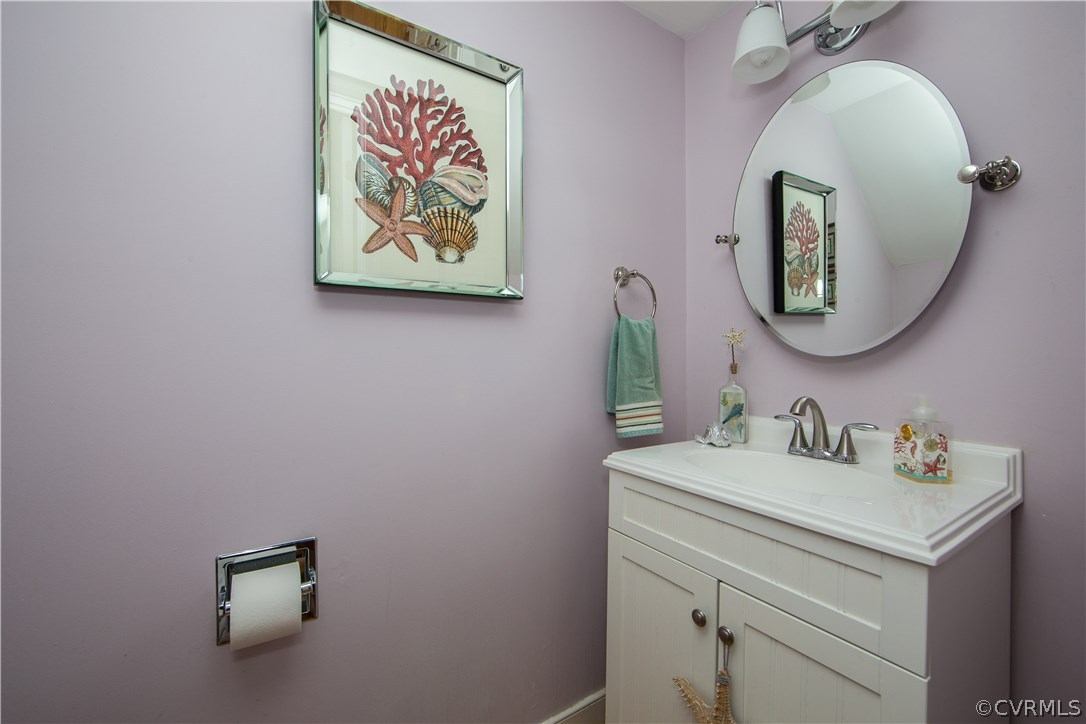 4907 Cedar Cliff Road Chester, VA 23831 - Photo 13 of 36 a bathroom with a sink and a mirror