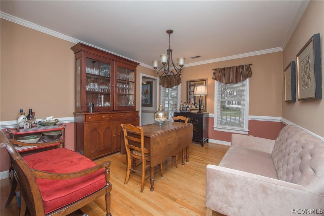 4907 Cedar Cliff Road Chester, VA 23831 - Photo 14 of 36 a living room with furniture and a chandelier