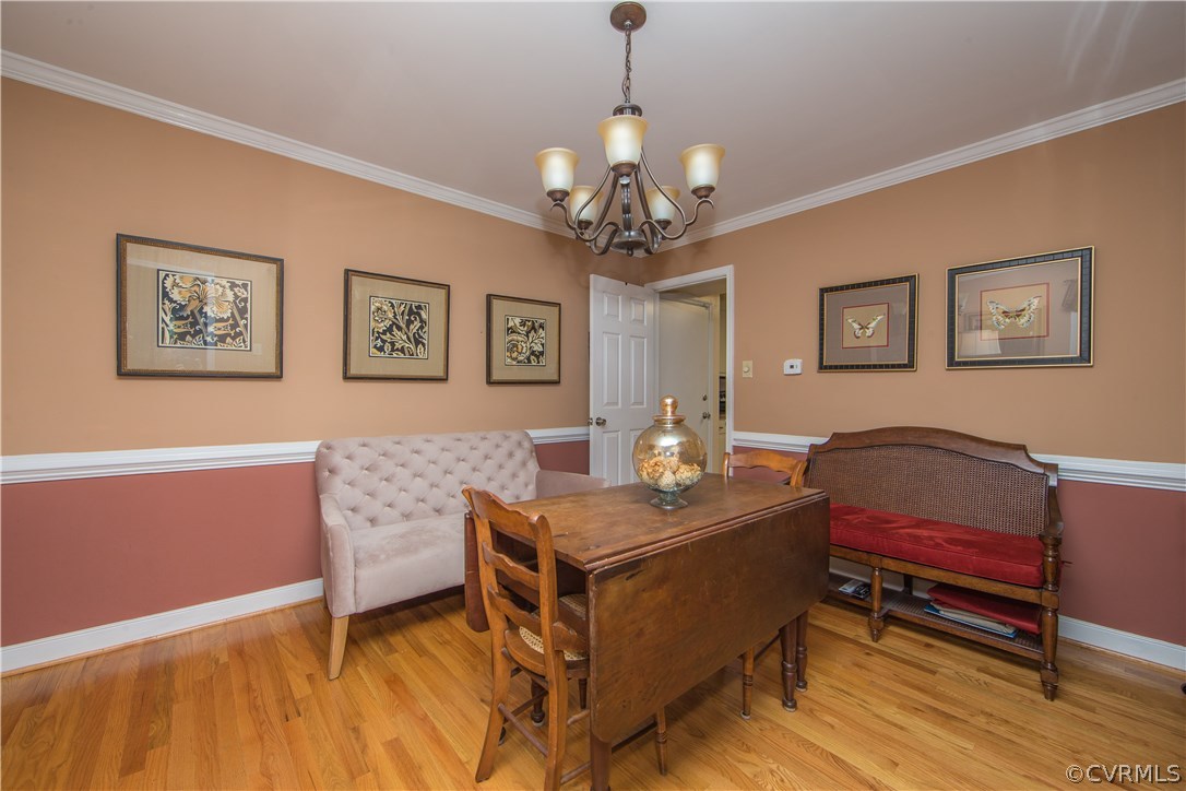 4907 Cedar Cliff Road Chester, VA 23831 - Photo 15 of 36 a living room with furniture and a chandelier