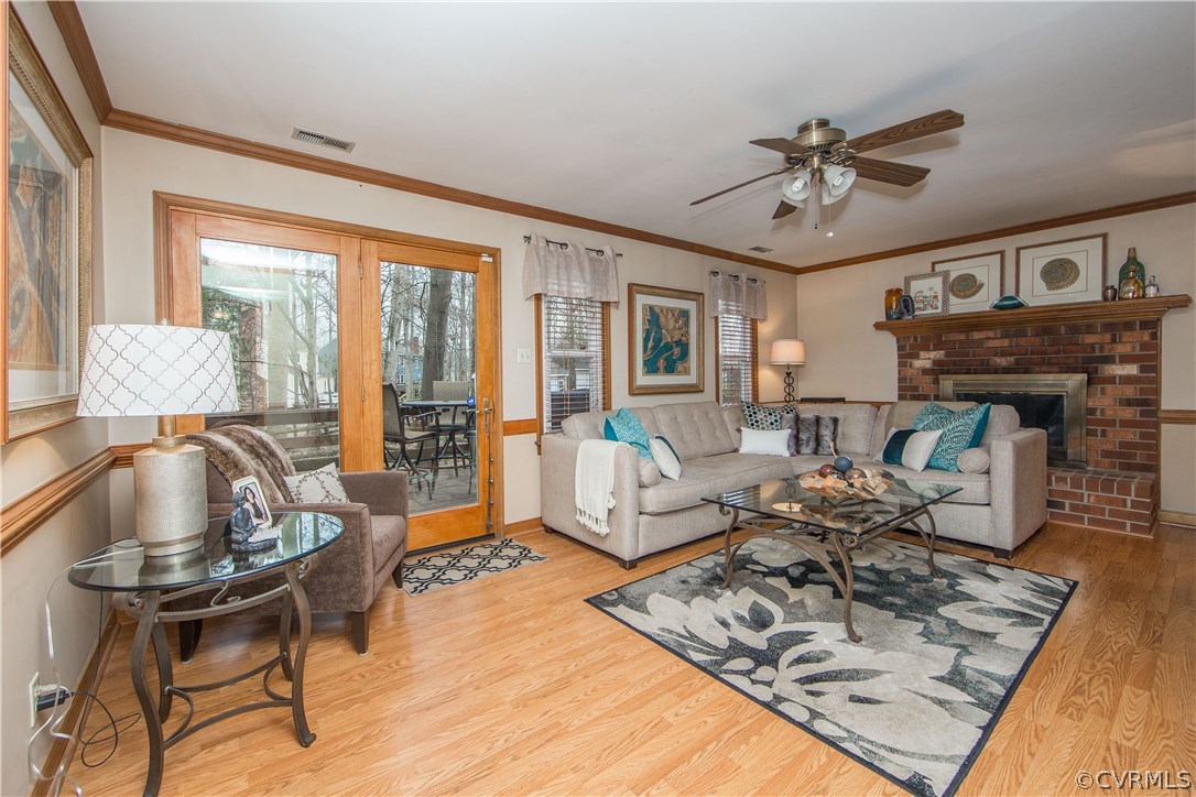 4907 Cedar Cliff Road Chester, VA 23831 - Photo 16 of 36 a living room with furniture and a fireplace