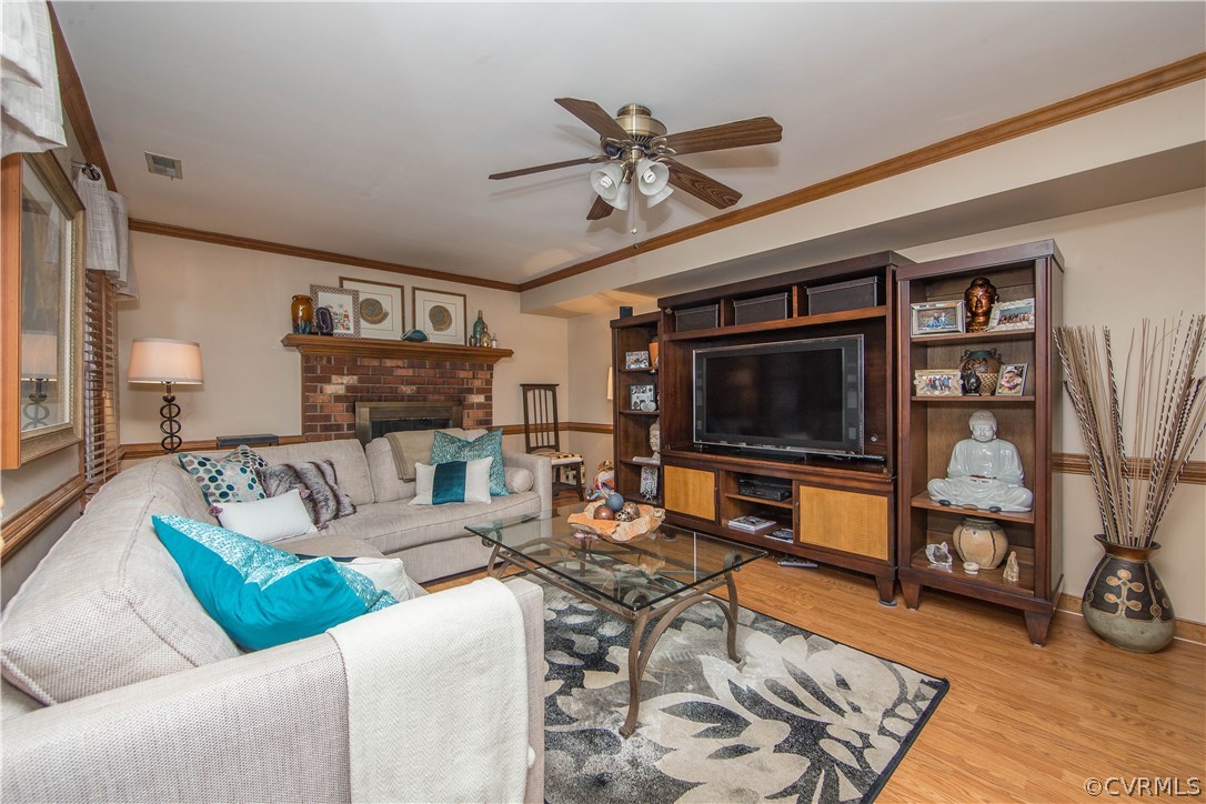 4907 Cedar Cliff Road Chester, VA 23831 - Photo 18 of 36 a living room with furniture and a flat screen tv