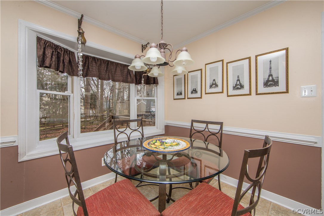 4907 Cedar Cliff Road Chester, VA 23831 - Photo 19 of 36 a view of a dining room with furniture window and wooden floor