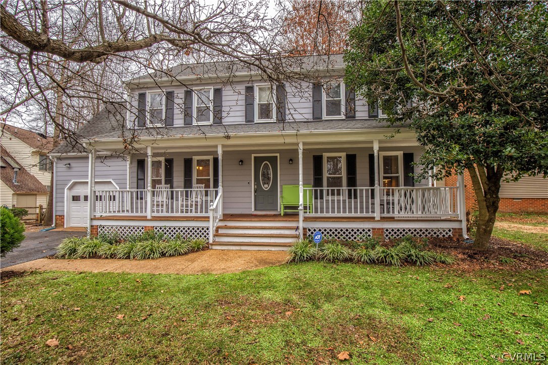 4907 Cedar Cliff Road Chester, VA 23831 - Photo 2 of 36 a front view of a house with a garden