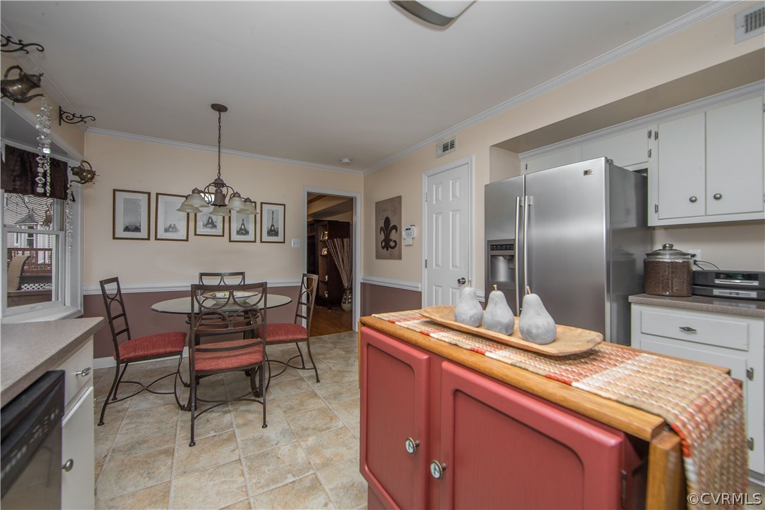 4907 Cedar Cliff Road Chester, VA 23831 - Photo 22 of 36 a kitchen with stainless steel appliances kitchen island granite countertop a refrigerator and a stove top oven