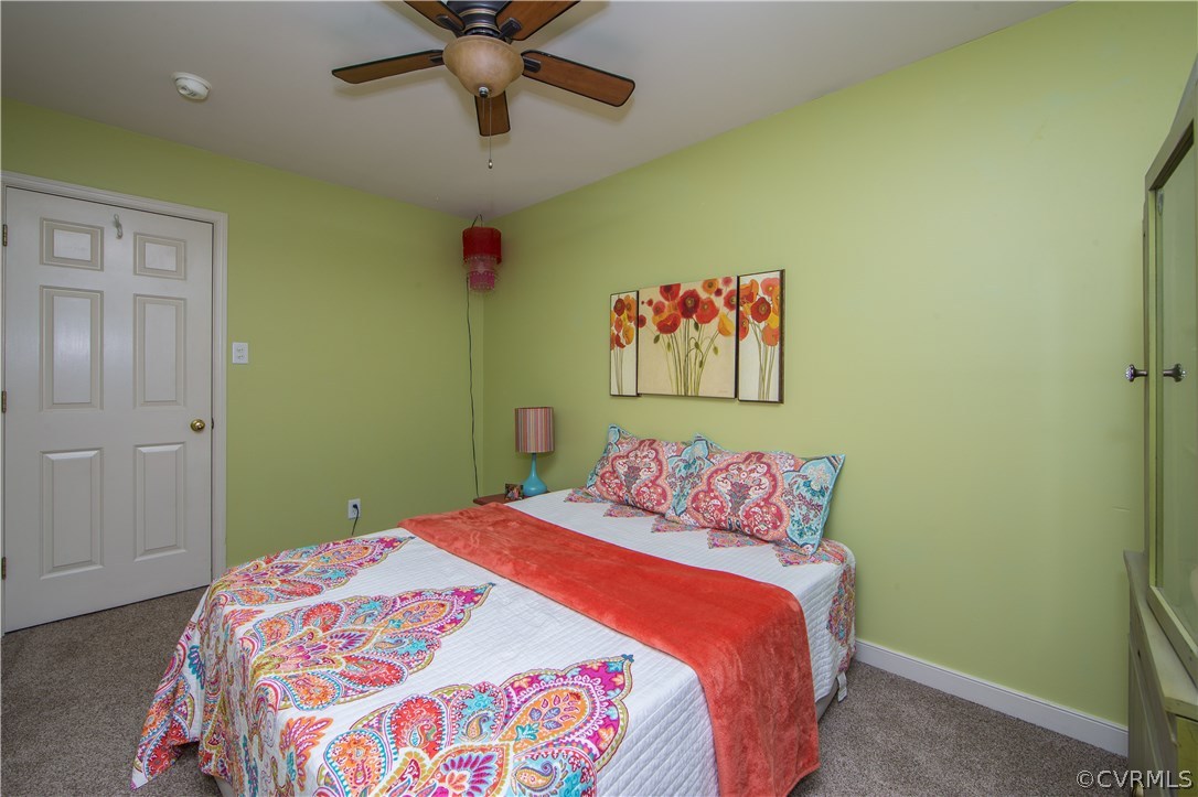 4907 Cedar Cliff Road Chester, VA 23831 - Photo 26 of 36 a bedroom with a bed and a painting on the wall