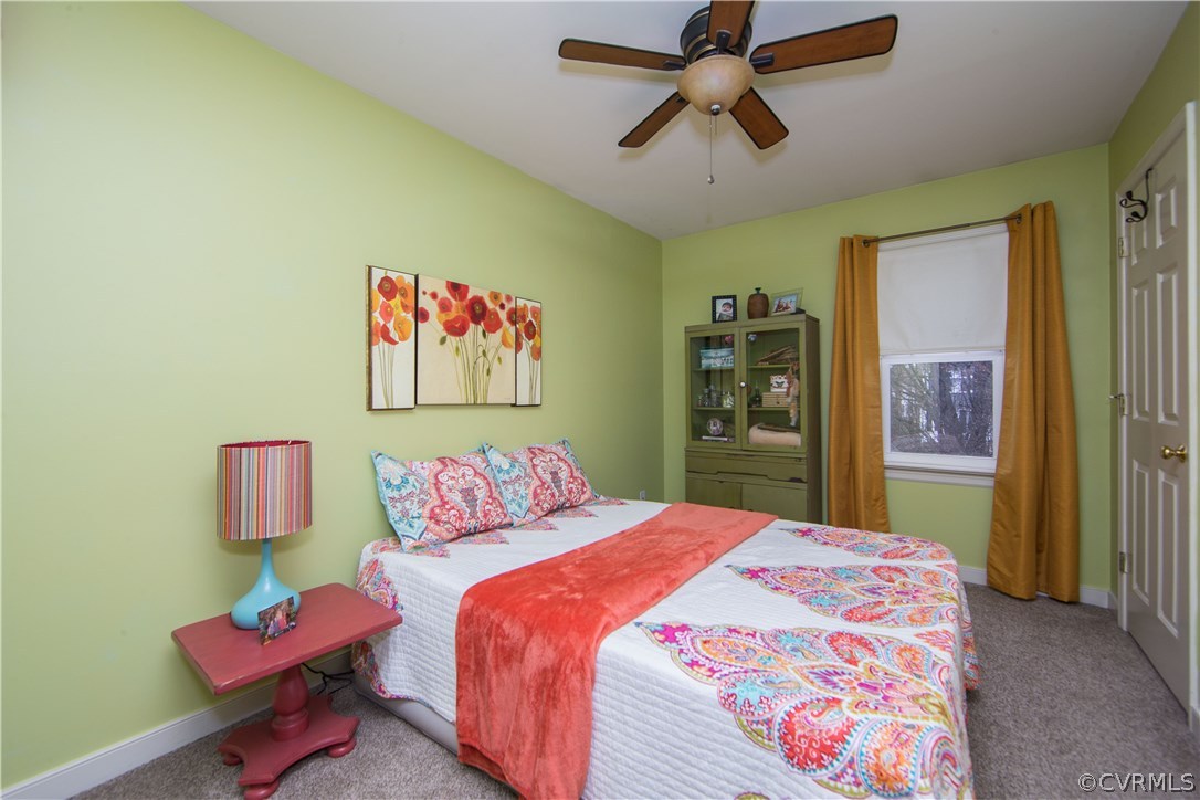 4907 Cedar Cliff Road Chester, VA 23831 - Photo 27 of 36 a bedroom with a bed and wooden floor