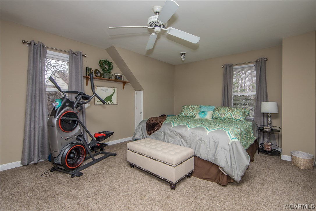 4907 Cedar Cliff Road Chester, VA 23831 - Photo 34 of 36 a bedroom with bed and a chandelier