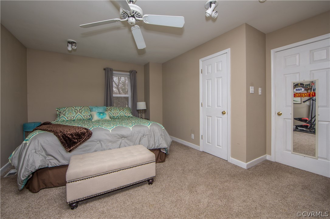 4907 Cedar Cliff Road Chester, VA 23831 - Photo 35 of 36 a bedroom with a bed and ceiling fan