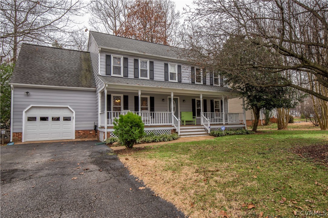 4907 Cedar Cliff Road Chester, VA 23831 - Photo 4 of 36 a front view of a house with a yard and garage