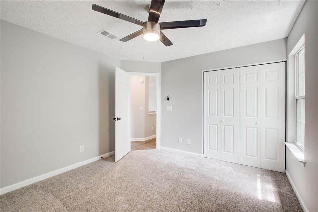 4110 Ridgebrook Bend Cumming, GA 30028 - Photo 39 of 49 a view of an empty room and a window