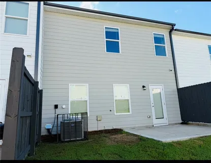 a view of house with yard