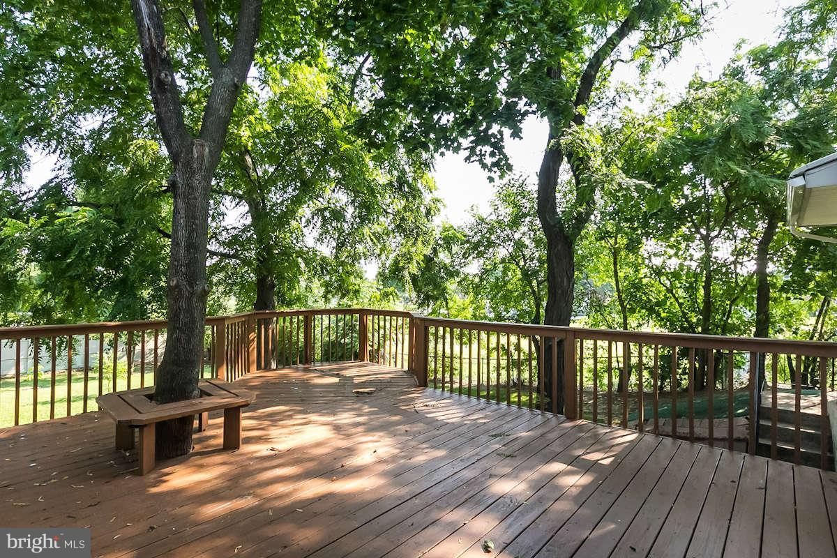 7722 Trappe Road Dundalk, MD 21222 - Photo 26 of 27 a view of balcony with wooden floor and outdoor seating