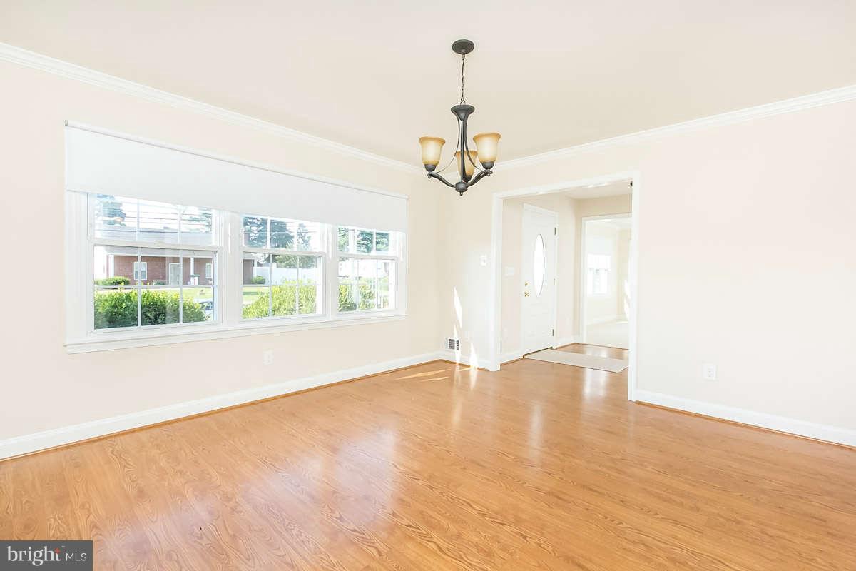 7722 Trappe Road Dundalk, MD 21222 - Photo 6 of 27 a view of an empty room with a window