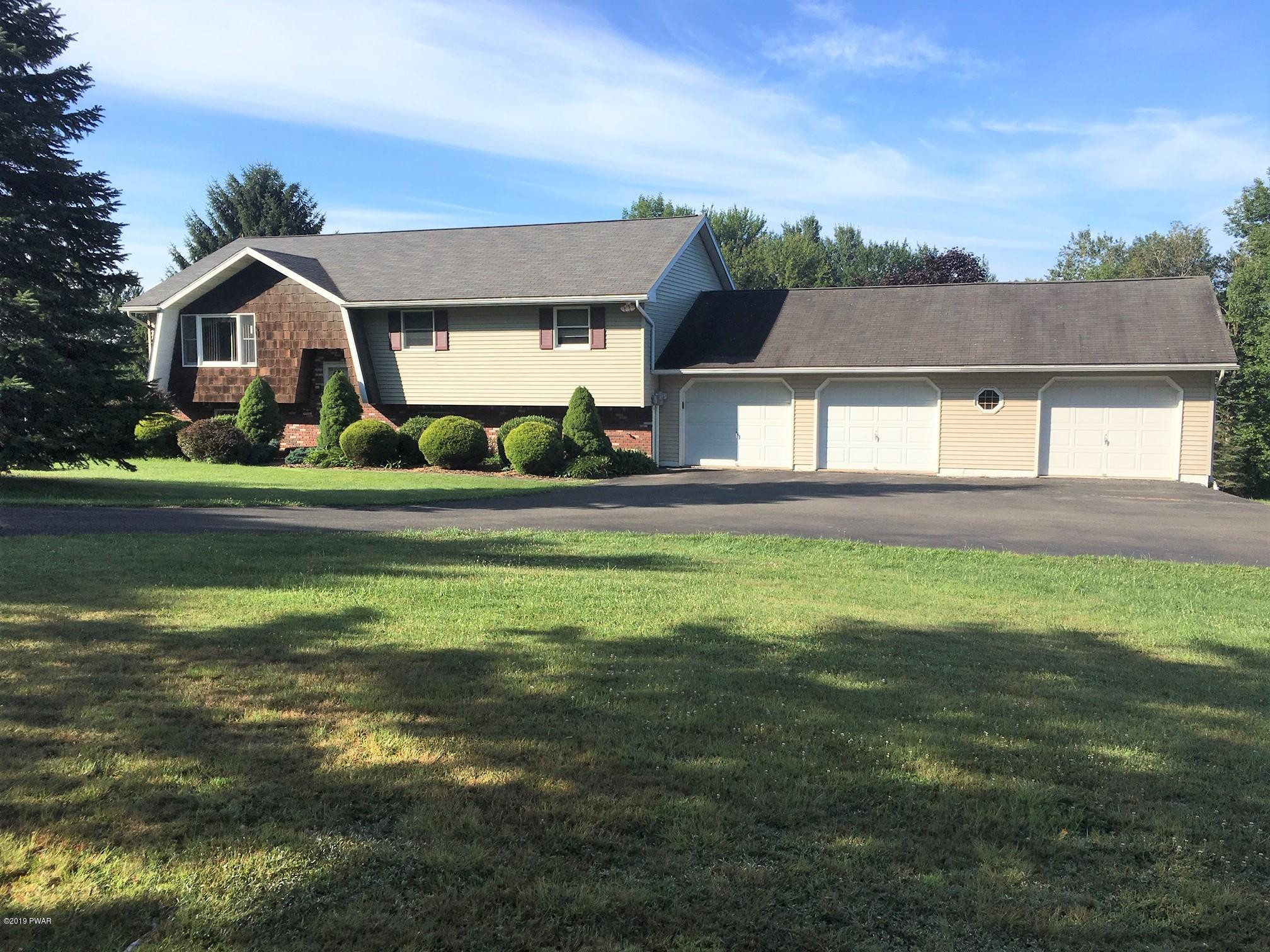 161 Tuthill Road Waymart, PA 18472 - Photo 2 of 31 a front view of house with yard and green space