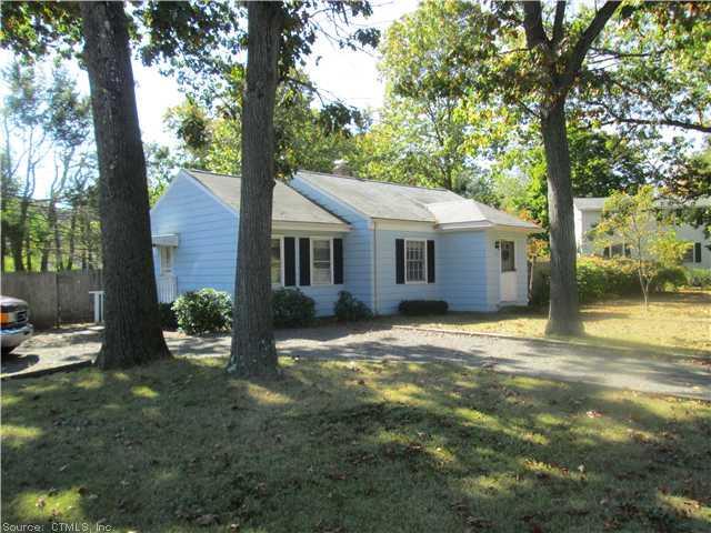 135 Sackett Point Road North Haven, CT 06473 - Photo 1 of 1 a front view of a house with garden