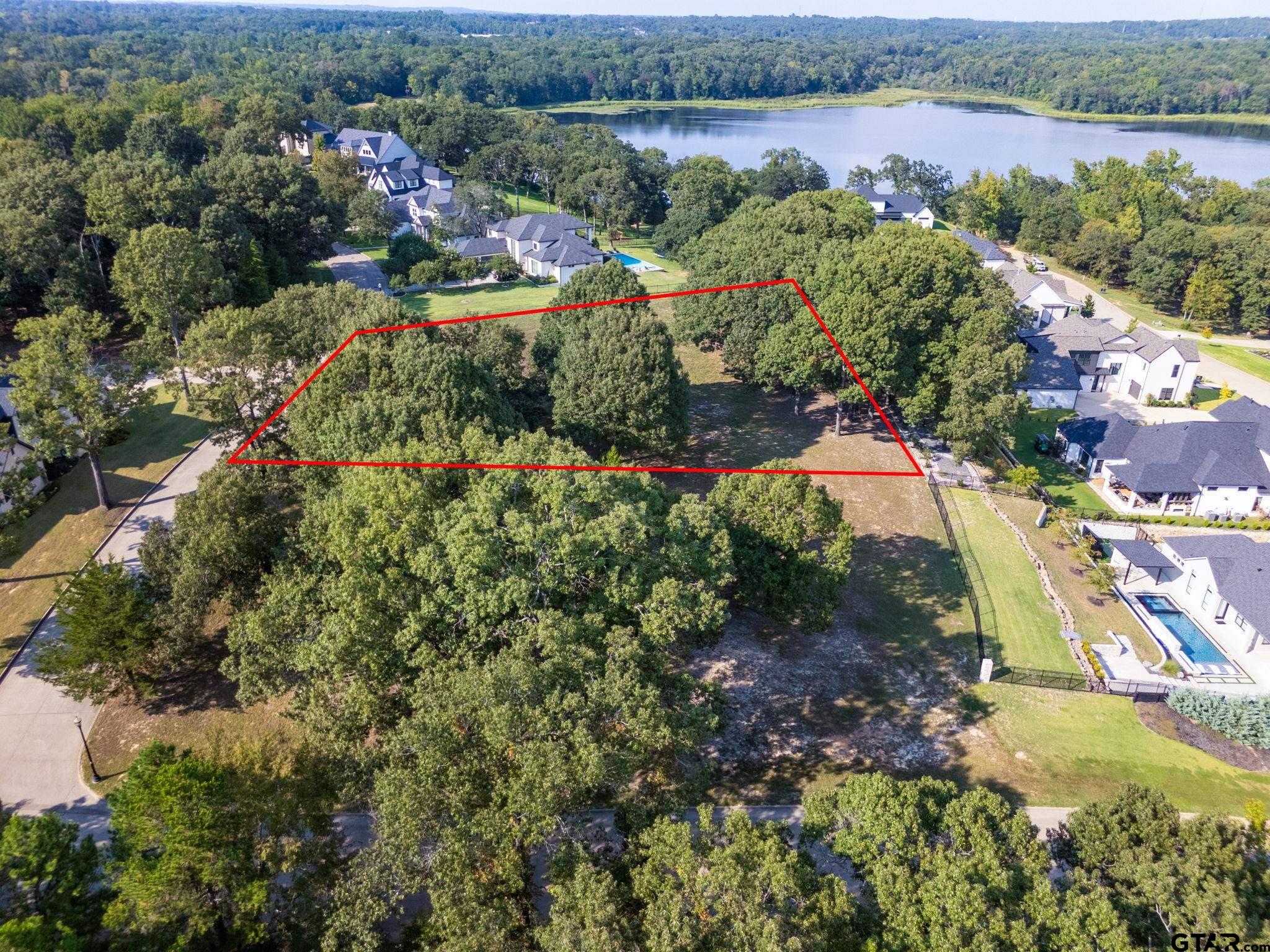 2473 Wellington Trace Tyler, TX 75709 - Photo 6 of 18 an aerial view of a houses with outdoor space and lake view