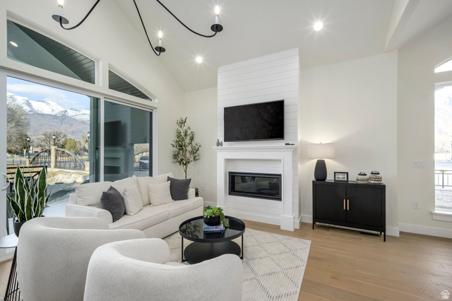 250 South Main Street, Unit 25 Alpine, UT 84004 - Photo 7 of 31 Living room featuring a mountain view, healthy amount of natural light, a fireplace, recessed lighting, and wood finished floors