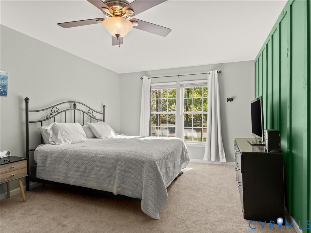 126 Reedy Creek Road Louisa, VA 23093 - Photo 36 of 68 Bedroom featuring a window with white curtains, a