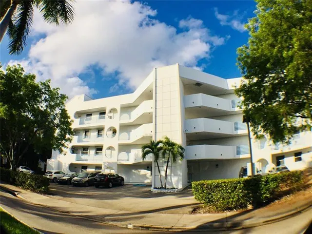 a front view of a house with parking space