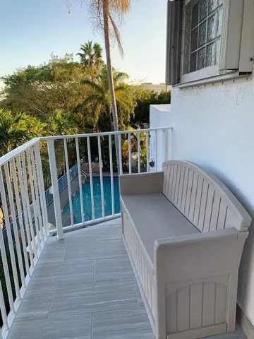a view of balcony with furniture