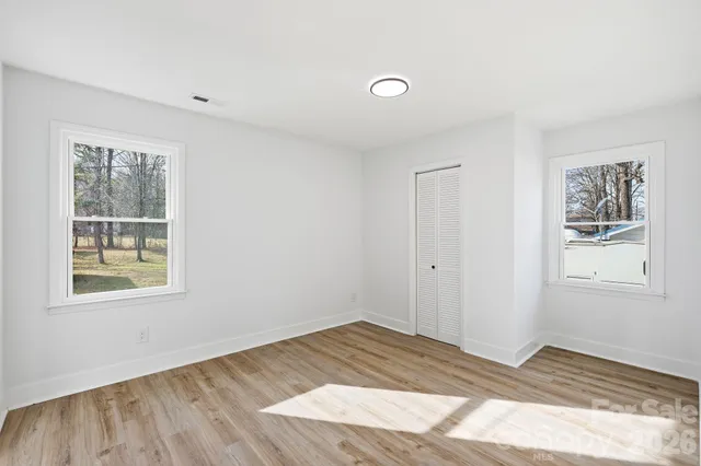 a view of an empty room and window