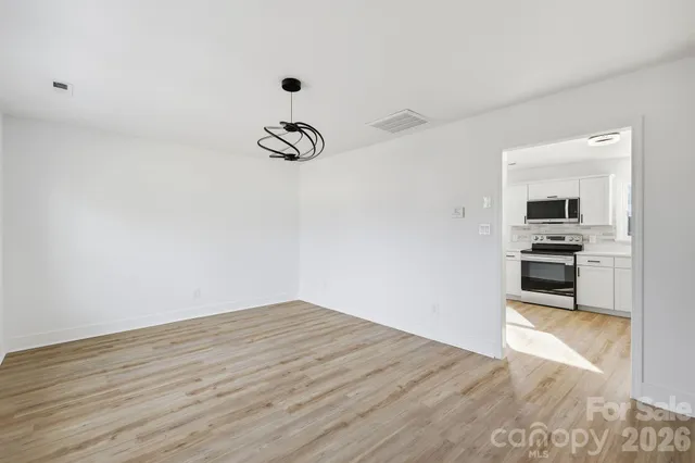 a view of kitchen with wooden floor