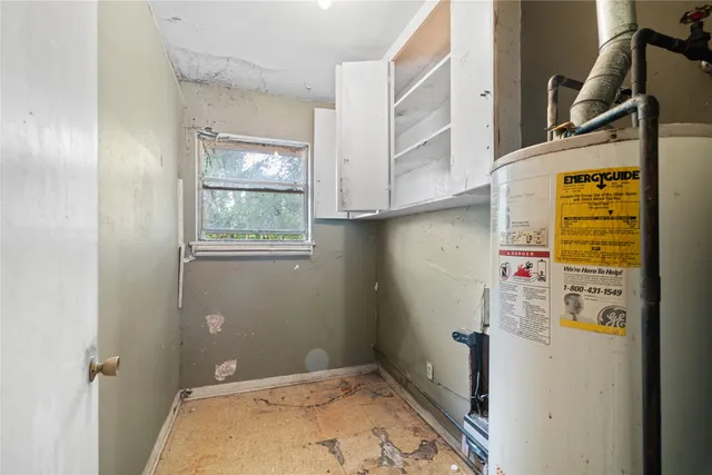 a bedroom with furniture and window