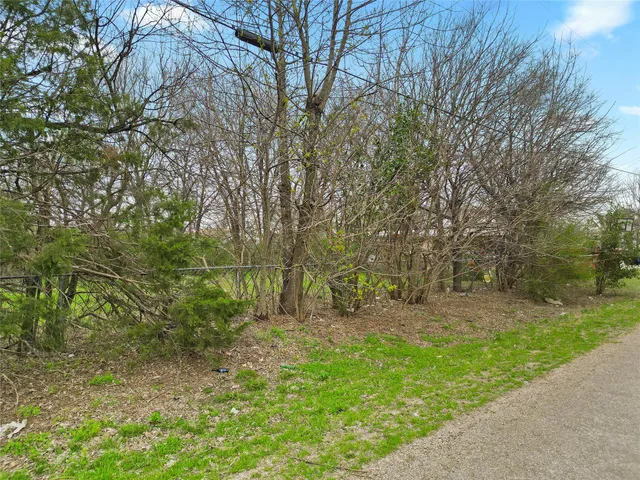 an aerial view of a house with a yard and outdoor seating