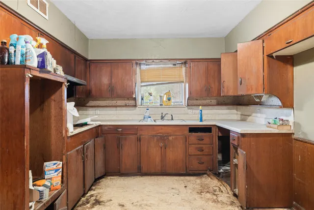 a view of kitchen and windows