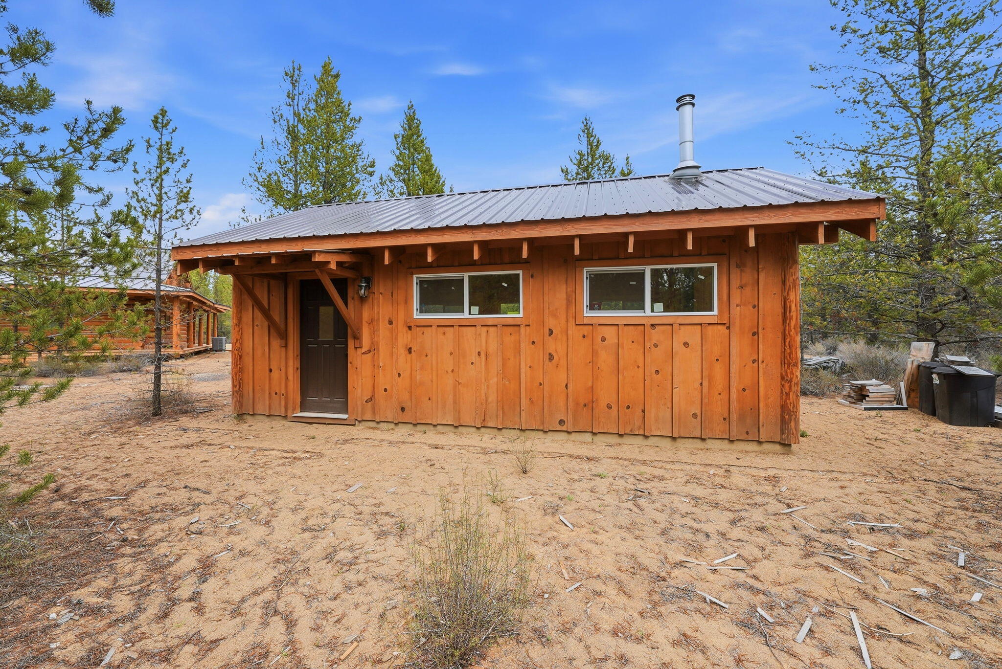 54270 Huntington Road La Pine, OR 97739 - Photo 30 of 68 a front view of a house with a yard and garage