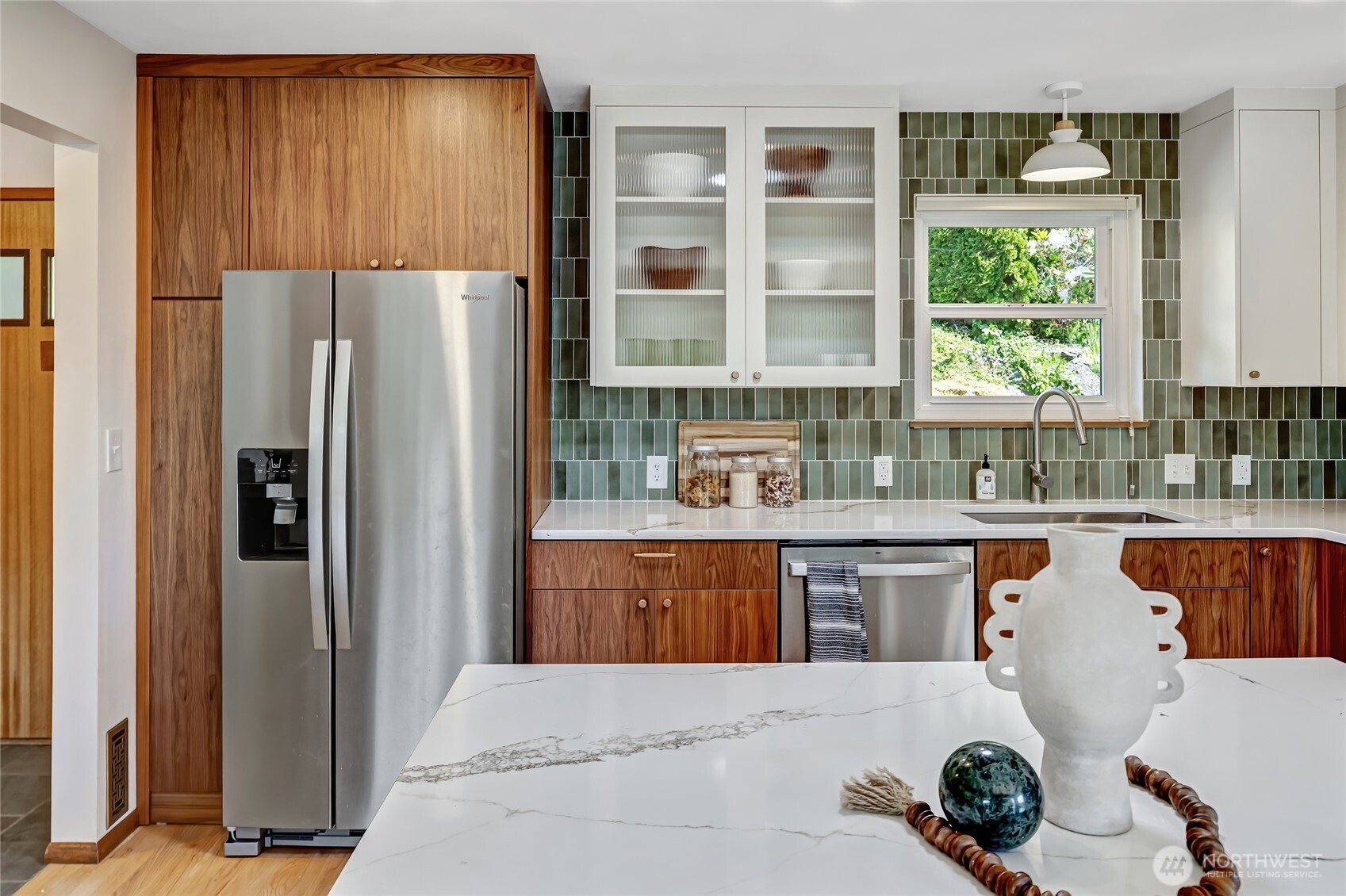 7571 45th Avenue Southwest Seattle, WA 98136 - Photo 16 of 40 a kitchen with stainless steel appliances granite countertop a refrigerator and a sink