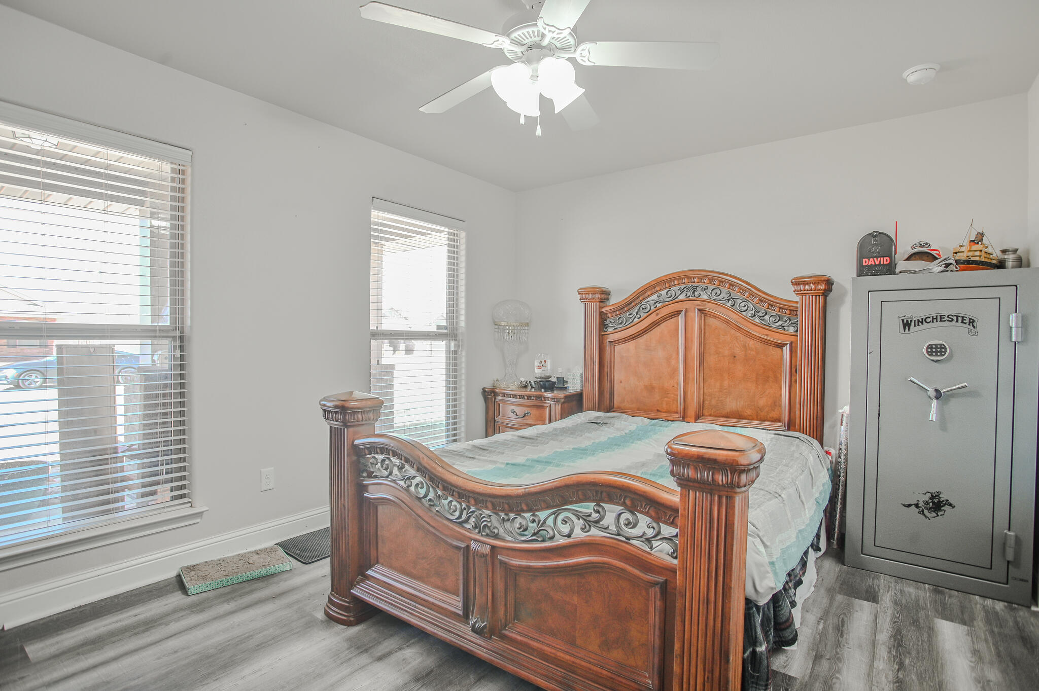 3637 Ridgely Avenue Lubbock, TX 79407 - Photo 23 of 37 a bedroom with a bed a dresser and window