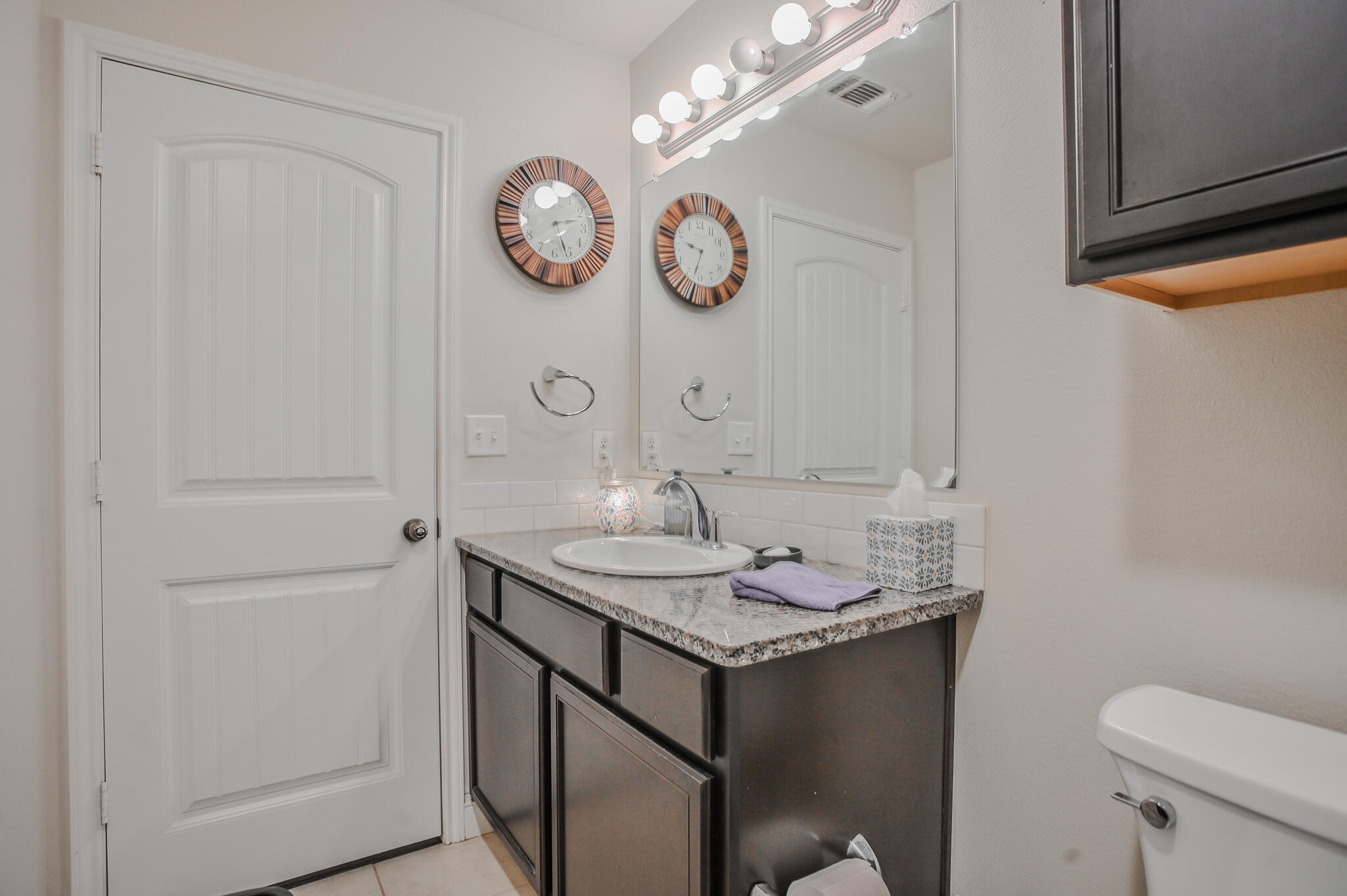 3637 Ridgely Avenue Lubbock, TX 79407 - Photo 27 of 37 a bathroom with a sink a toilet and vanity