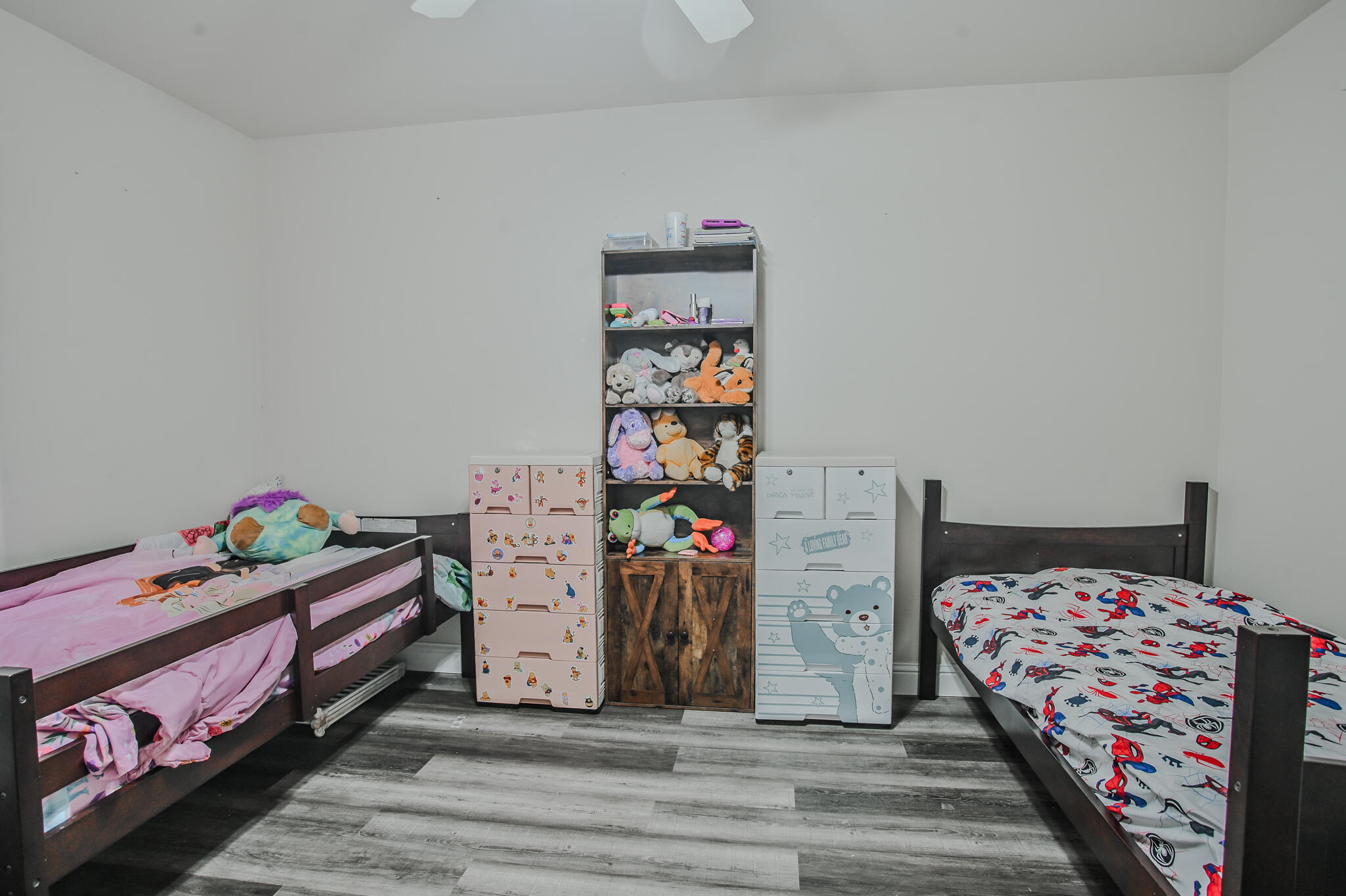 3637 Ridgely Avenue Lubbock, TX 79407 - Photo 29 of 37 a bedroom with bed and a chandelier