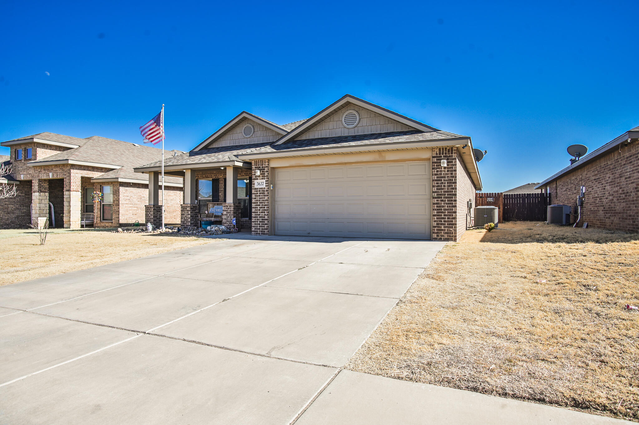 3637 Ridgely Avenue Lubbock, TX 79407 - Photo 3 of 37 a front view of a house with a yard