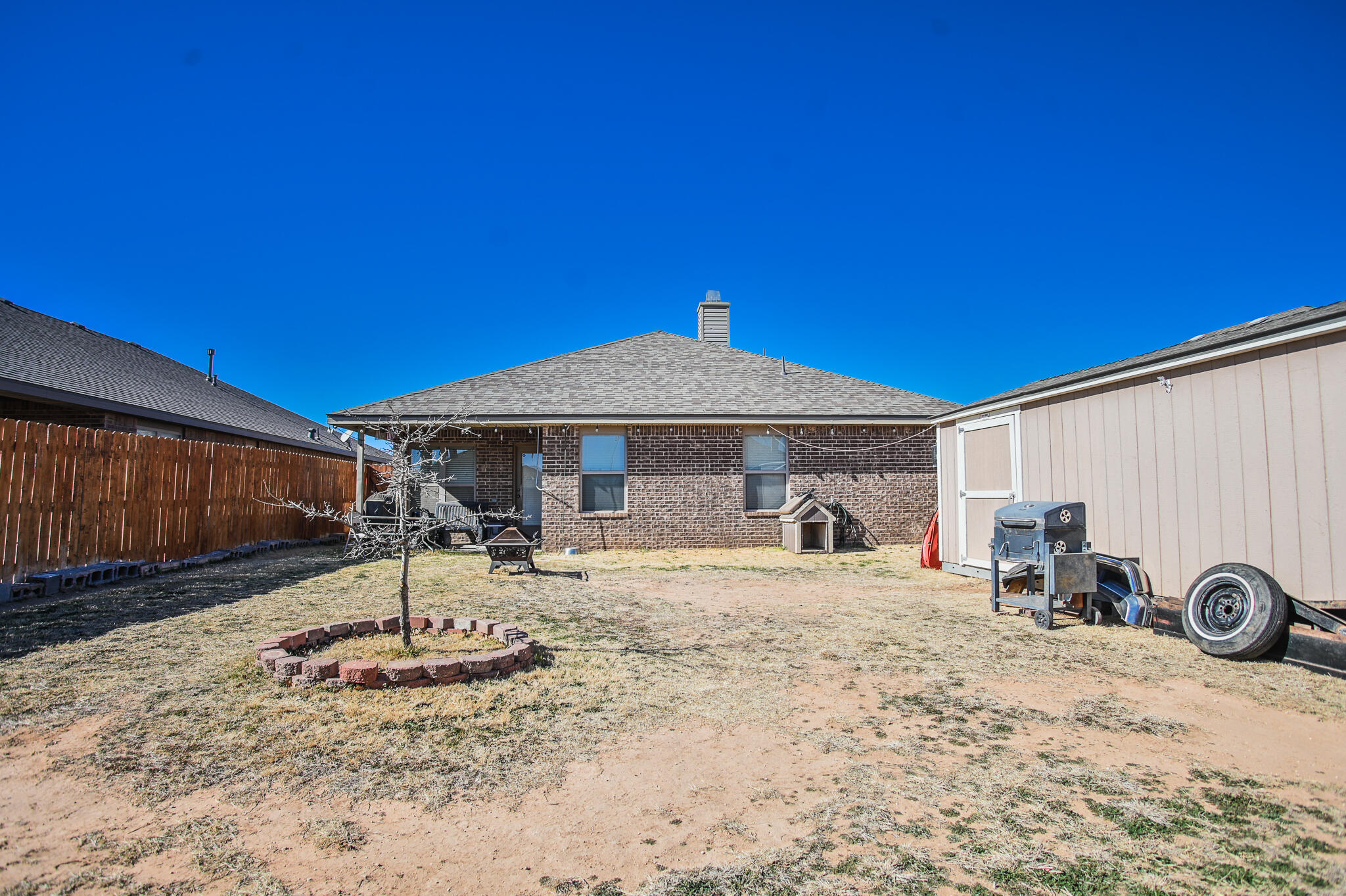 3637 Ridgely Avenue Lubbock, TX 79407 - Photo 35 of 37 a front view of a house with a yard
