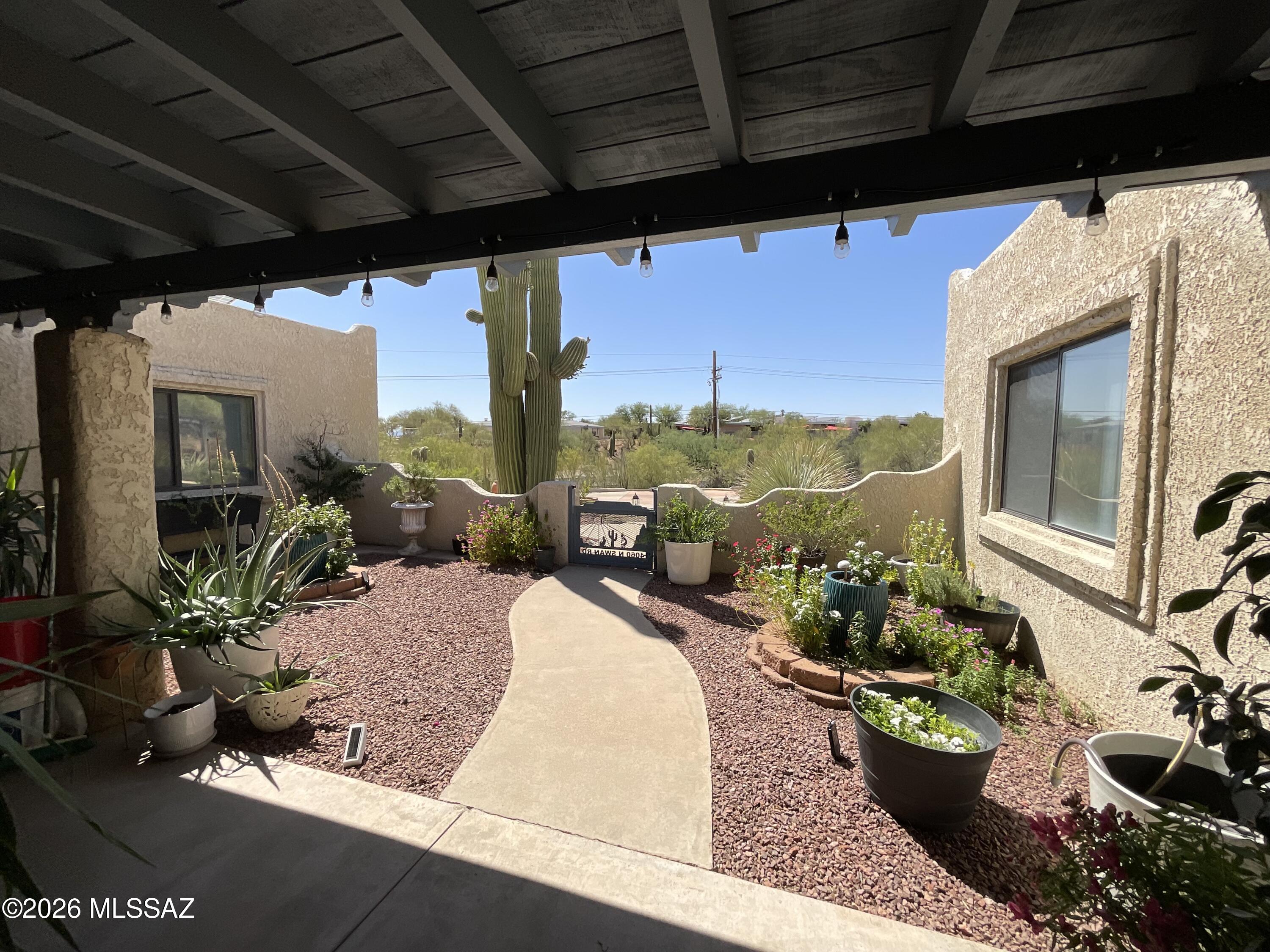 4060 North Swan Road Tucson, AZ 85718 - Photo 7 of 47 a building outdoor space with patio furniture and potted plants