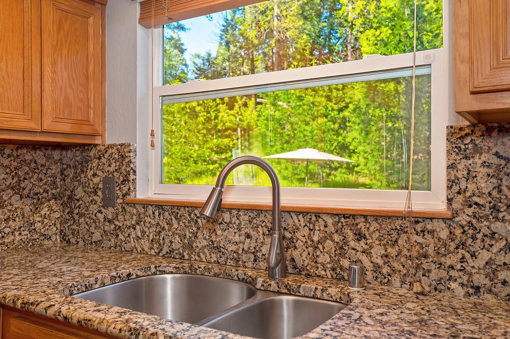 5415 Robert Road Pollock Pines, CA 95726 - Photo 25 of 72 Granite counter tops with beautiful kitchen views