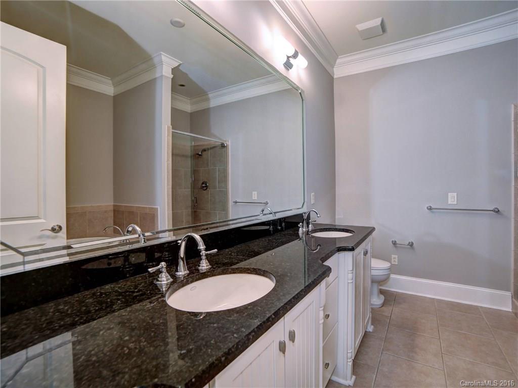 2823 Providence Road, Unit 121 Charlotte, NC 28211 - Photo 14 of 22 a bathroom with a sink and a mirror