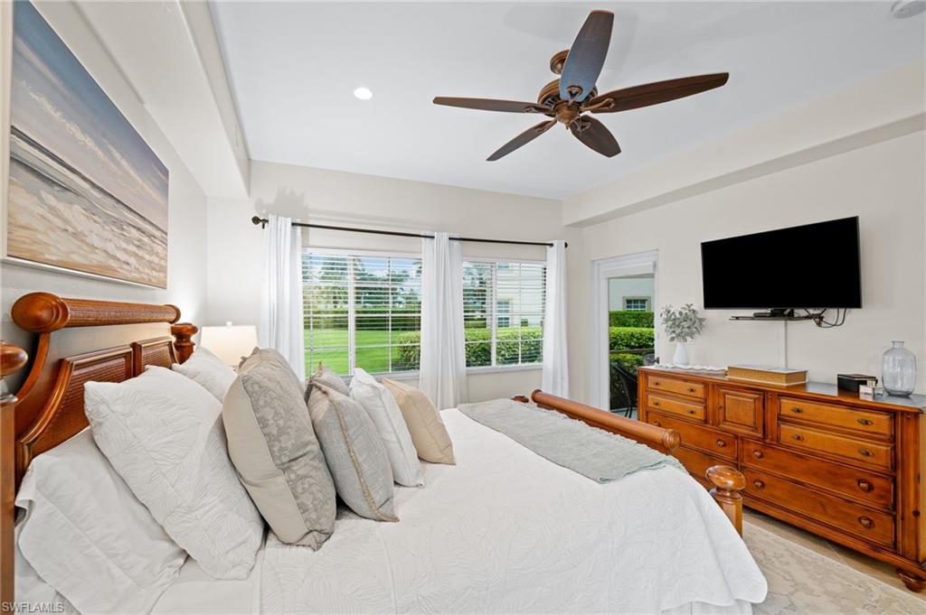 9128 Michael Circle, Unit 9 Naples, FL 34113 - Photo 11 of 50 Bedroom with ceiling fan