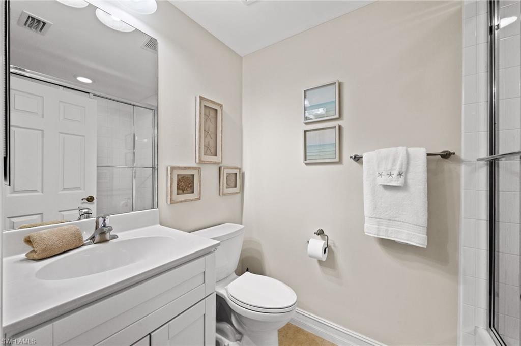 9128 Michael Circle, Unit 9 Naples, FL 34113 - Photo 15 of 50 Bathroom featuring vanity and toilet