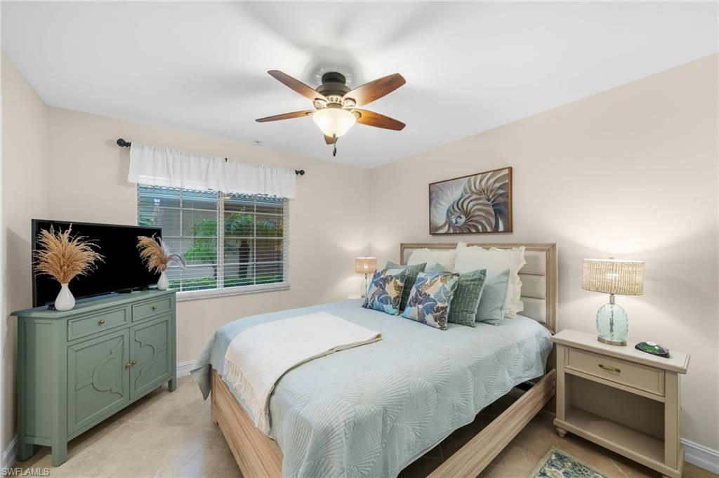 9128 Michael Circle, Unit 9 Naples, FL 34113 - Photo 16 of 50 Tiled bedroom featuring ceiling fan
