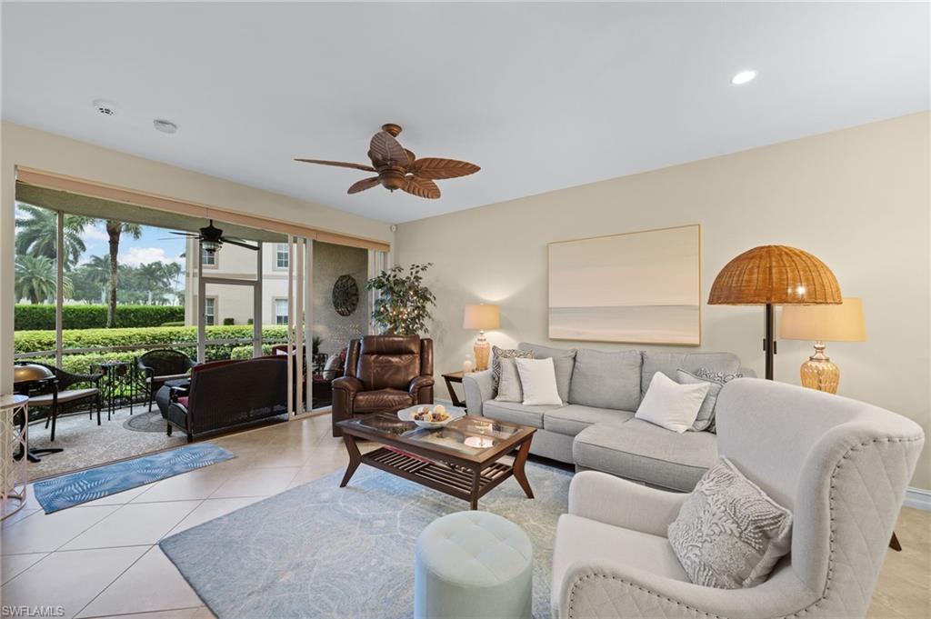 9128 Michael Circle, Unit 9 Naples, FL 34113 - Photo 3 of 50 Living room with ceiling fan and light tile flooring