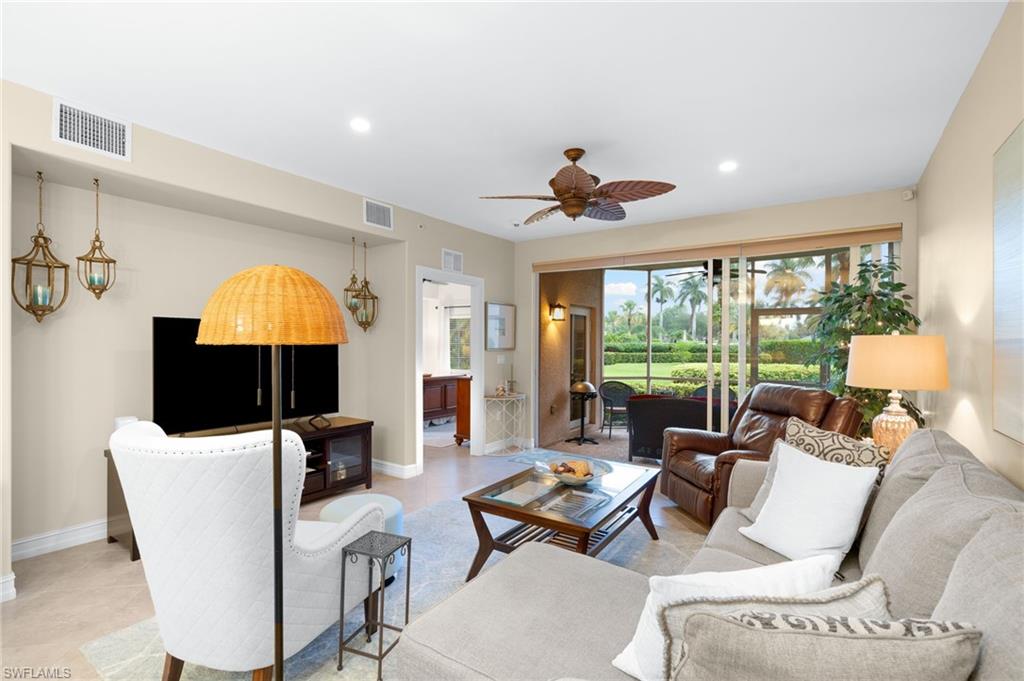 9128 Michael Circle, Unit 9 Naples, FL 34113 - Photo 4 of 50 Living room with tile flooring and ceiling fan