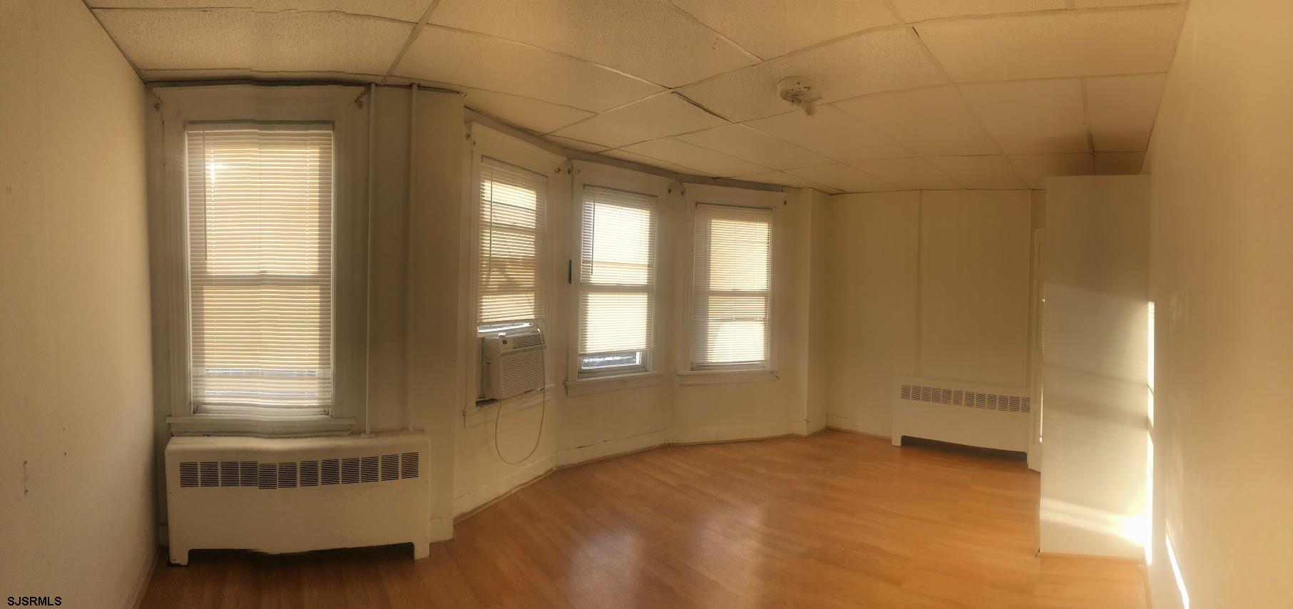 85-91 North Main Street, Unit A Pleasantville, NJ 08232 - Photo 10 of 10 a bedroom with a bed and a window