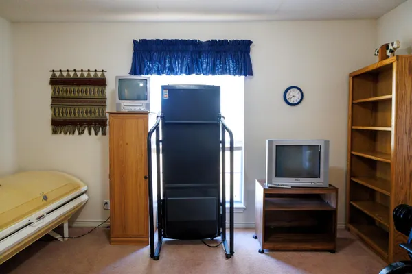 a kitchen with a refrigerator and a stove